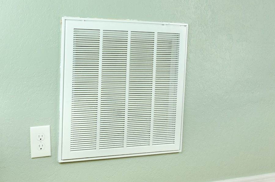 Home air conditioner and heating air filter intake vent on wall that leads to the handler.
